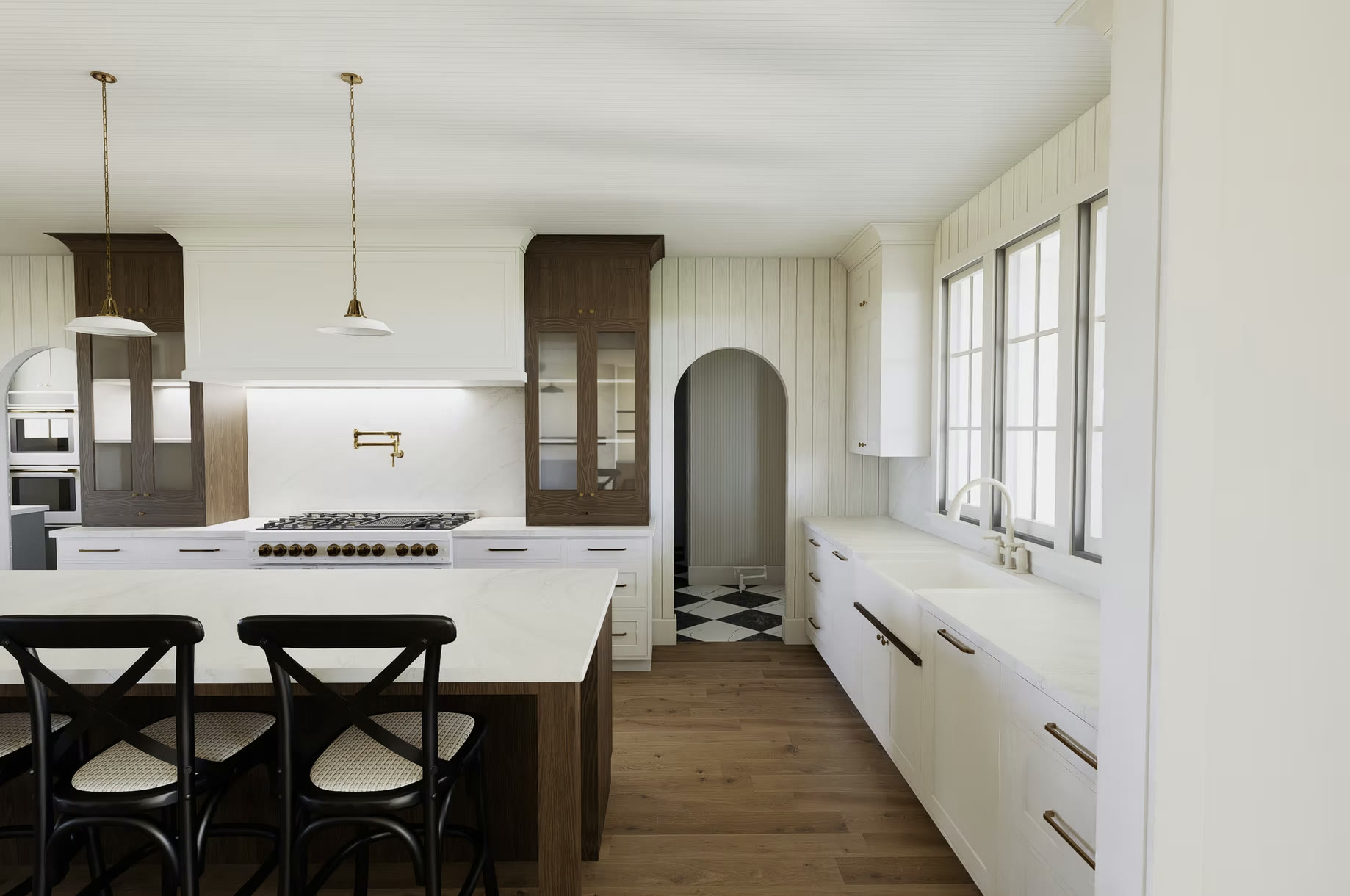 Kitchen with brass fixtures and arched doorway
